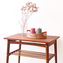Coffee table with magazine shelf on wheels