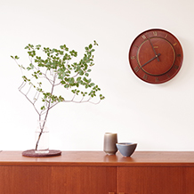 Clementa / Wall clock in teak and brass