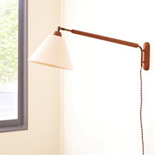 Swing arm wall lamp in solid teak & brass