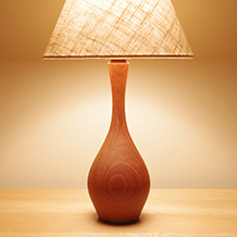 Drop shaped table lamp in solid teak