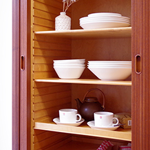 Bow front cabinet with tambour doors