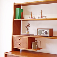 Bookshelf with sliding doors and postcard holder