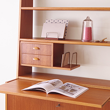 Bookshelf with postcard holder and writing board