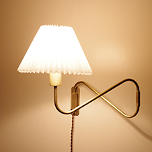 Swing arm wall lamp in brass