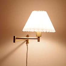 Swing arm wall lamp in brass