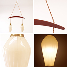 A pair of pendants with drop shaped glass shades